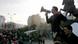 A man speaks into a megaphone at a demonstration in Kosovo