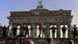 Berliners sing and dance on top of The Berlin Wall to celebrate the opening of East-West German borders