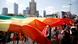 People carrying a rainbow banner at an 'Equality Parade' rally in Warsaw on June 19