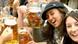 Young women toast the camera at Oktoberfest